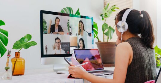 Asian business woman work from home with laptop, tablet and computer on table with meeting online and video conferencing.Concept of social distancing to stop the spread disease of Corona virus. 