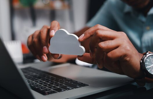 Businessmen use laptops to secure computing through cloud storage for digital business and cloud data processing management. Optimizing online business customer service