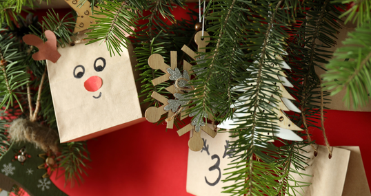 Christmas Advent calendar with spruce on red background