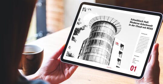 Mockup image of a woman holding digital tablet with blank white desktop screen in cafe