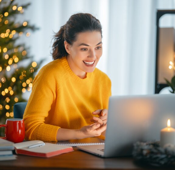 Woman working in home office before Christmas