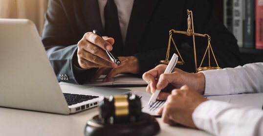 business people and lawyers discussing contract papers sitting at the table. Concepts of law, advice, legal services. in morning light