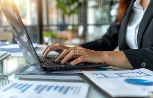 business woman close up of a person typing on a laptop computer