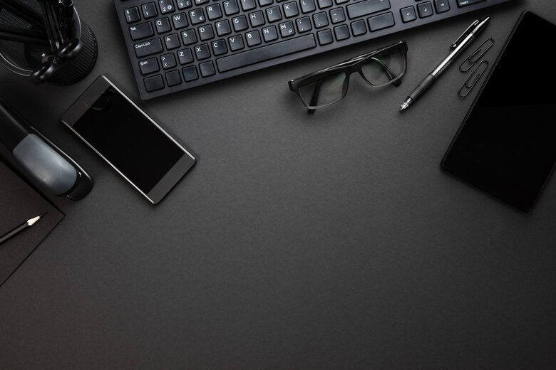 Office Supplies With Computer Keyboard On Gray Desk