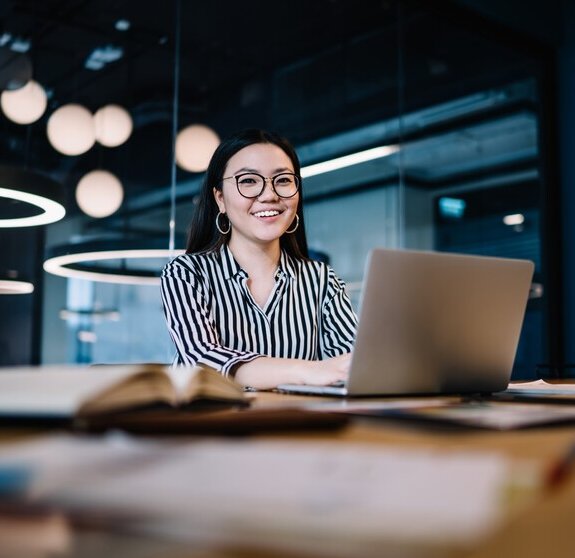 Happy woman working with laptop