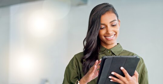 Business woman typing an email, browsing the internet and searching for ideas on a tablet at work. Female corporate professional, expert and designer scrolling on social media or reading a blog