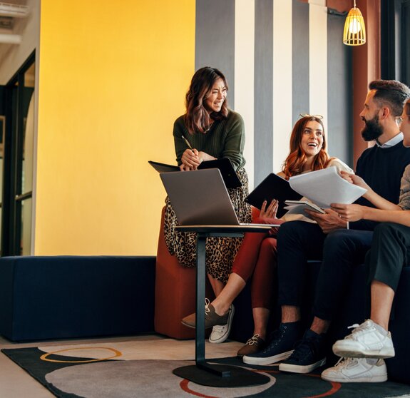 Multicultural businesspeople working in an office lobby