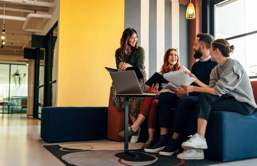 Multicultural businesspeople working in an office lobby