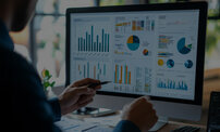 Business finance data analytics male worker analyzing graphs and charts on computer screen